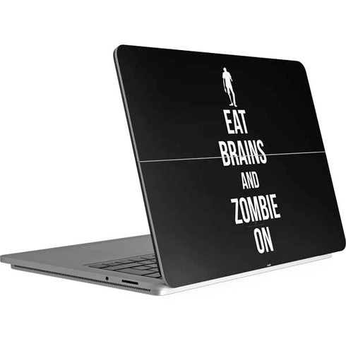 Eat Brains and Zombie On Black Surface Laptop Studio Skin