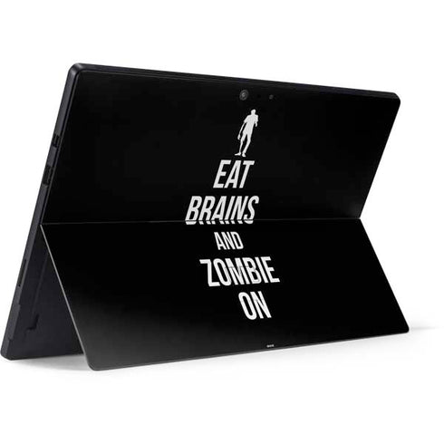 Eat Brains and Zombie On Black Surface Pro 7 Skin