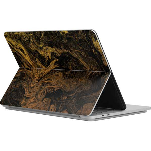 Gold and Black Marble Surface Laptop Studio Skin