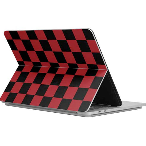 Red and Black Checkerboard Surface Laptop Studio Skin