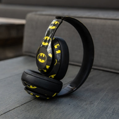 Headphones with a custom Batman logo skin