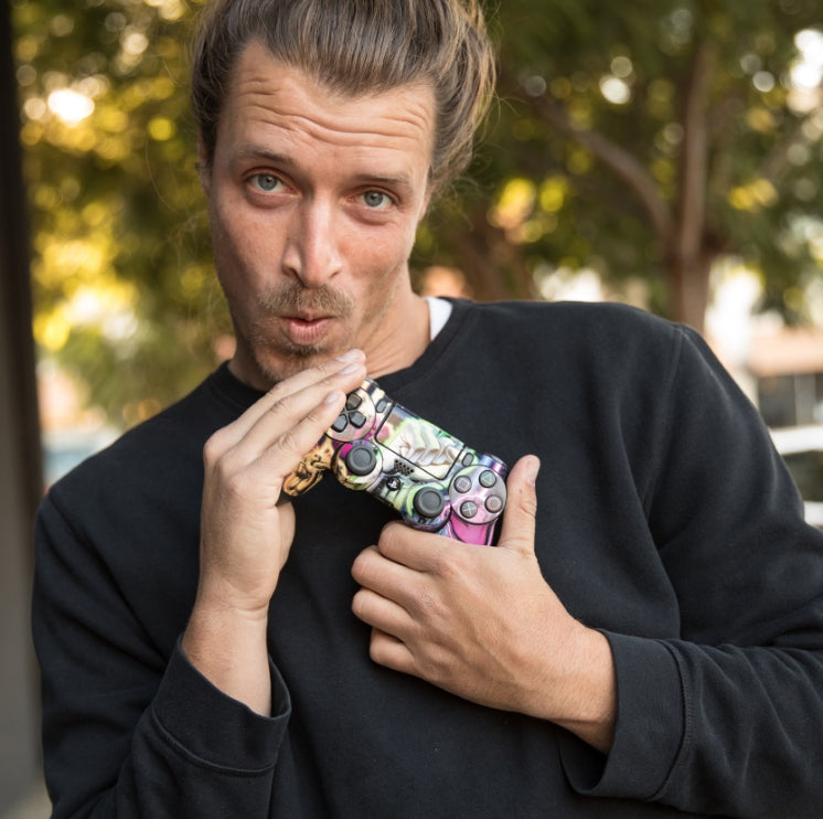 Man holding a custom skin Playstation controller