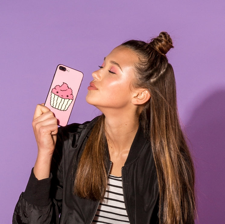 Woman holding a phone with a custom cupcake case