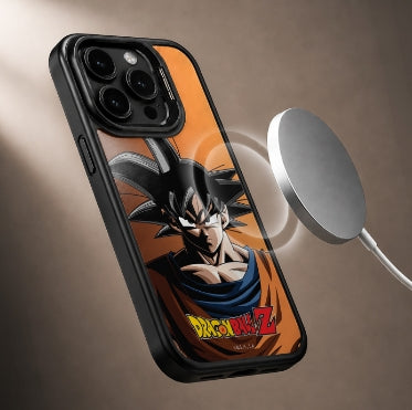 A black phone case featuring an anime print of Goku from Dragon Ball Z on an orange background, shown floating next to a silver wireless charging pad on a brown gradient background.