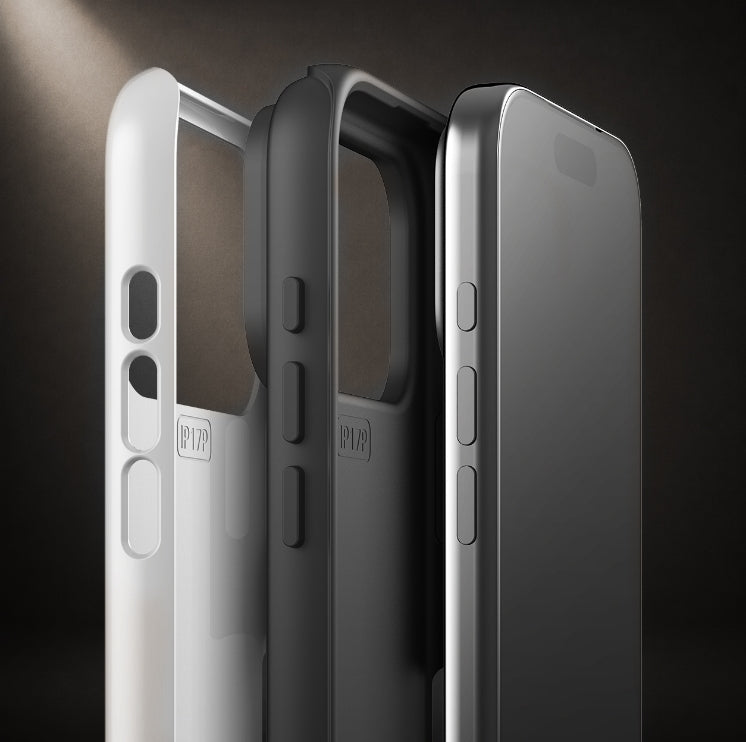 Three slim smartphone cases shown upright in a studio-style dark setting: a white case on the left, a translucent smoky gray case in the center, and a dark gray case on the right. No person, animal, or real environment is present, so this is Product/Packaging.