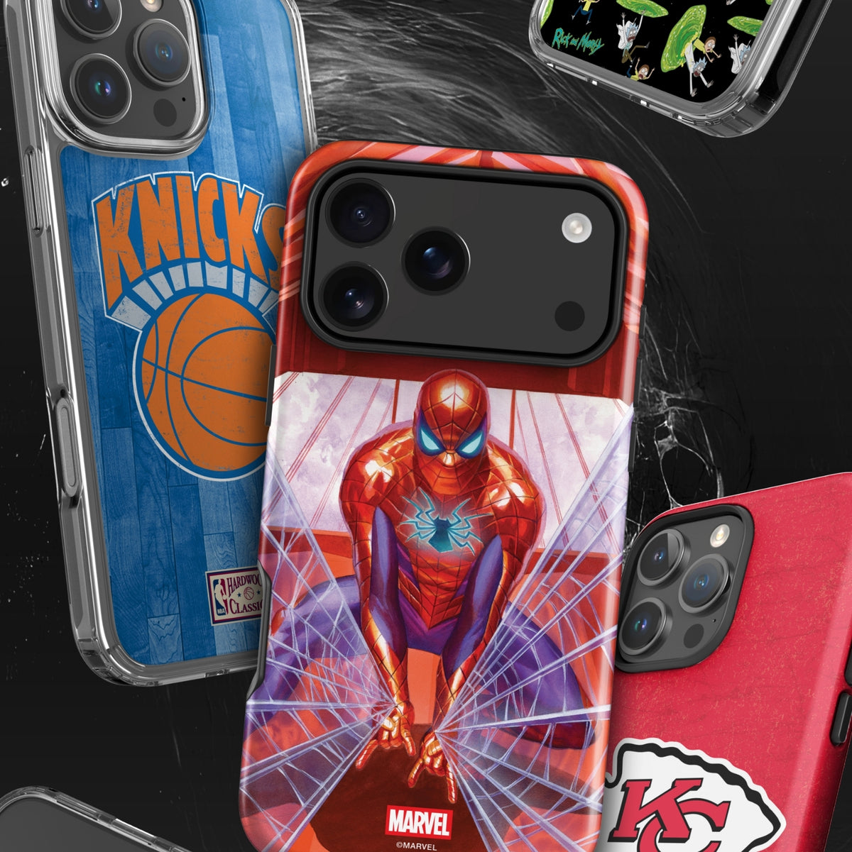 A group of smartphone cases shown on phones against a dark background. The central case features Spider-Man artwork with red, blue, and white tones, while surrounding cases show other sports-themed designs including Knicks, Kansas City Chiefs, and a green patterned case.